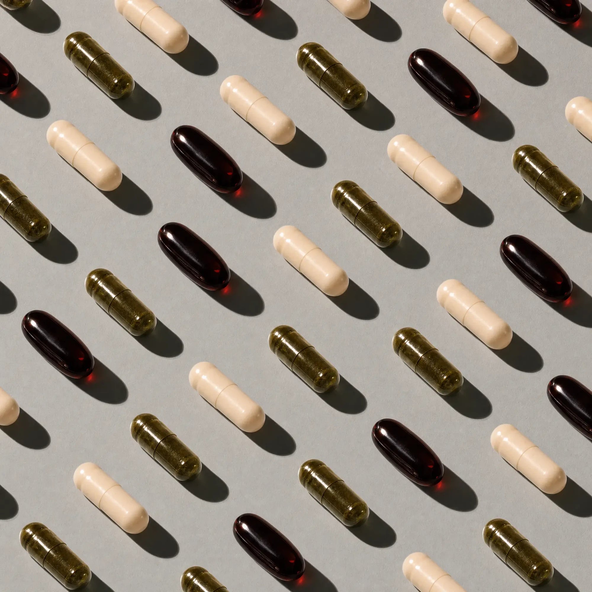 Omiro capsules arranged in a repeating flat-lay pattern